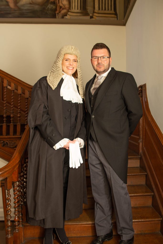 A woman KC standing on steps in Chambers with senior Clerk