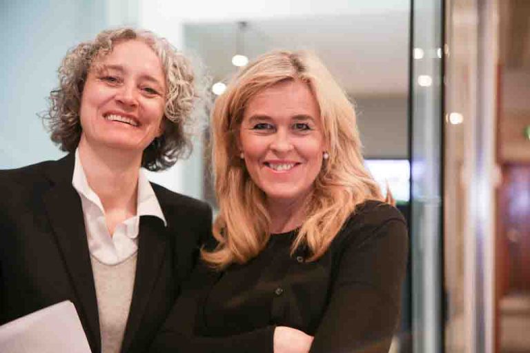 Two corporate women at office